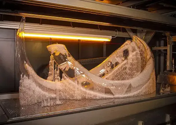 Large 3D printed carbon fibre part on the printer bed