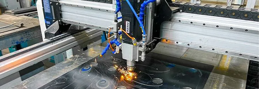 Laser cutting a dense pattern of bores and slots into a steel sheet
