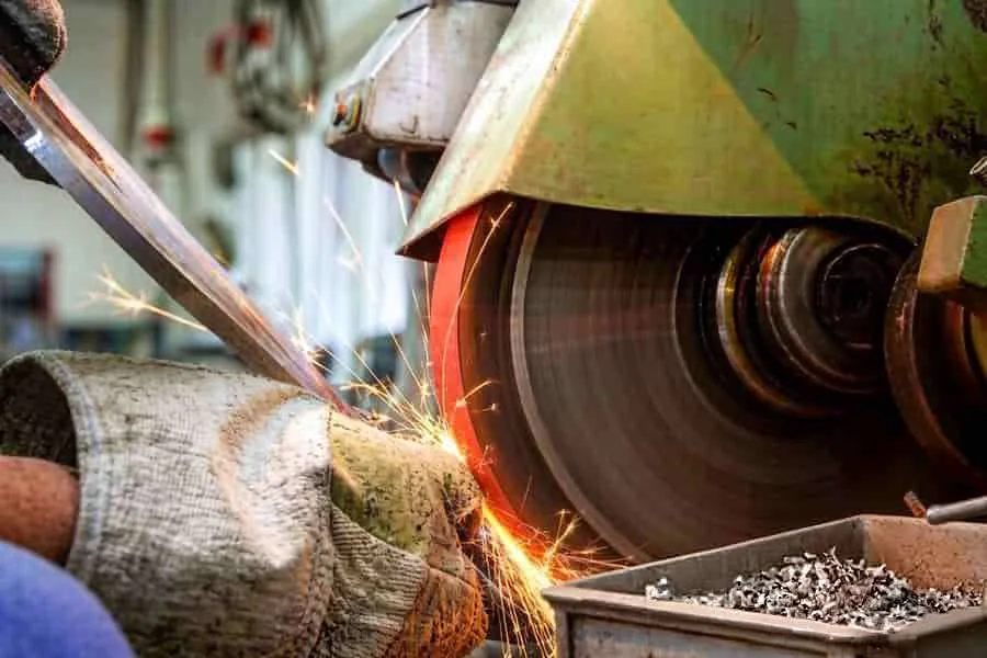 Grinding the bevel edge on a pipe end for weld fit-up