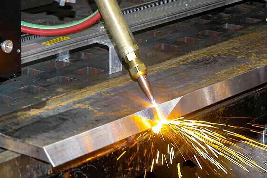 Oxy-fuel torch cutting a bevel on a thick plate edge