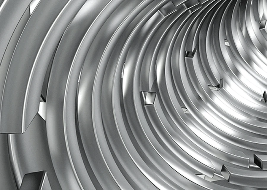 Stainless steel coil end faces stacked in a warehouse