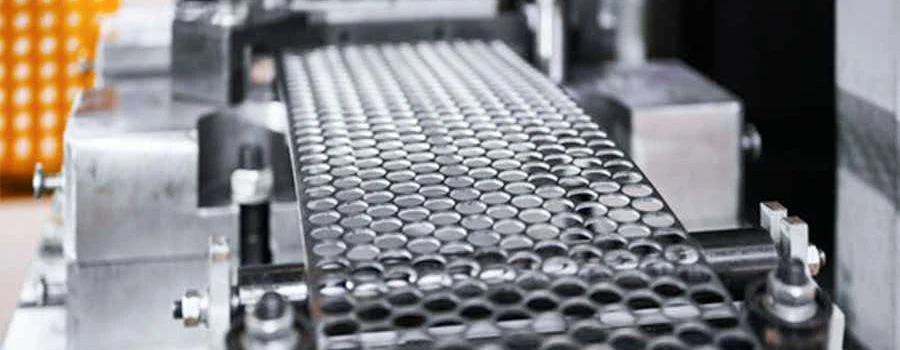 Perforated stainless sheet in a stamping die