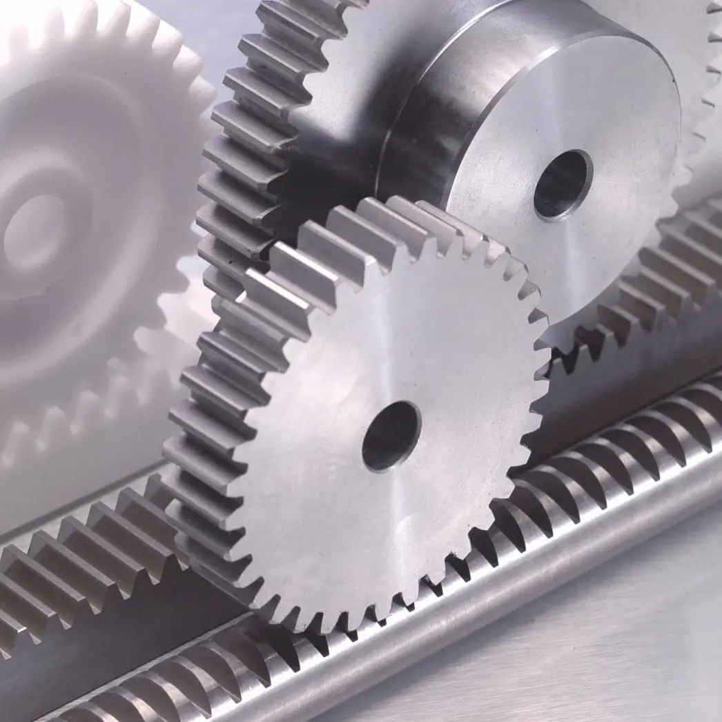 Rack and pinion converting rotary motion into linear travel
