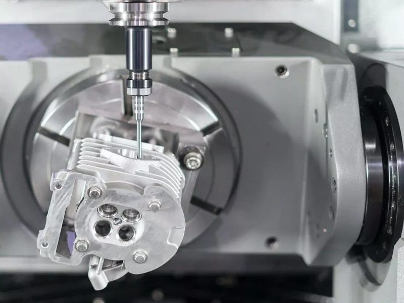 5-Axis CNC Milling Machine creating complex precision parts by milling from multiple directions