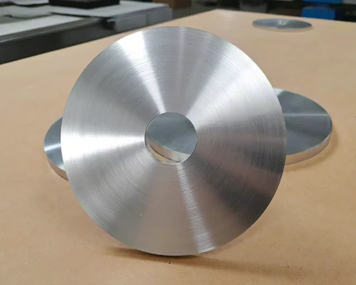 Aluminum circles stacked after blanking