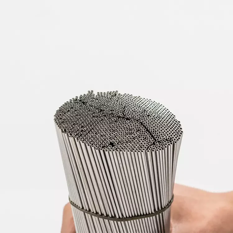 Bundle of fine stainless steel capillary tubes held in hand